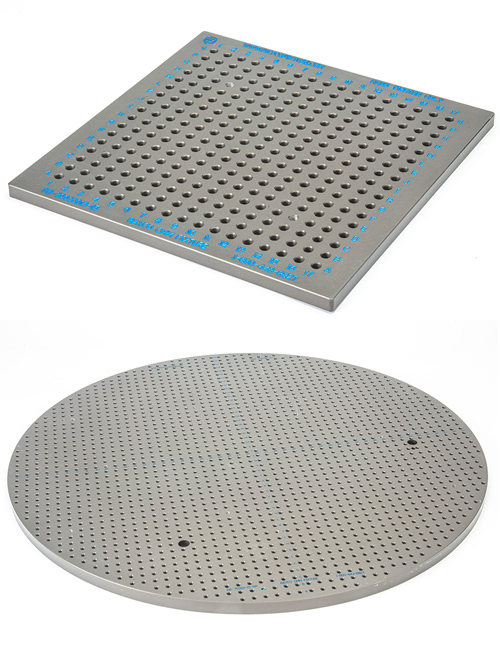 Two fixture plates: a rectangular one is on top and a circular one is on the bottom