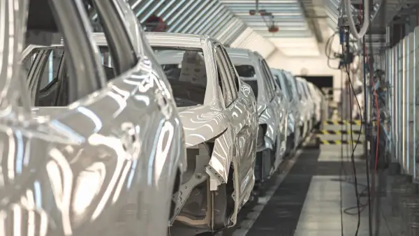 White car frames on an assembly line